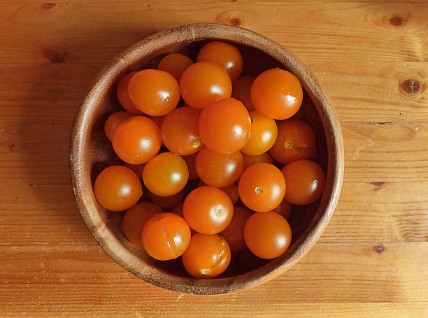 istock Orange cherry in the bowl and near it 596786272