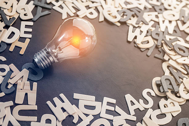 istock vintage light bulb and wooded alphabet 596788824