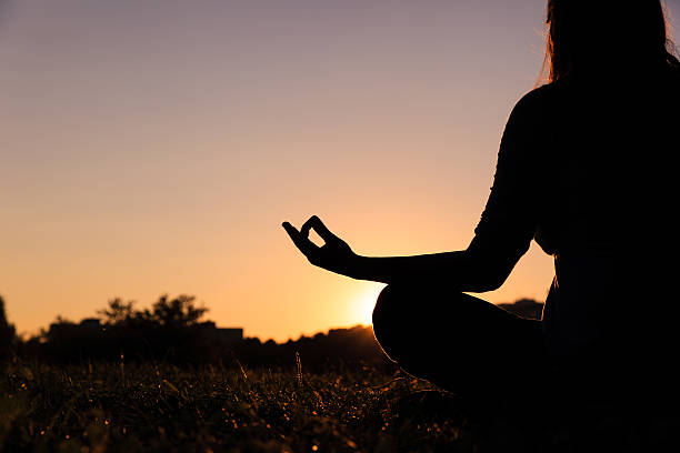 istock serenity and yoga practice at sunset 596789534