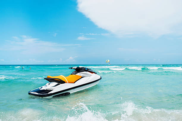 istock Blue sea and a jet ski floating on the sea, 596792170
