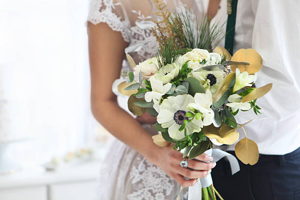 Bride holding wedding bouquet. Close up