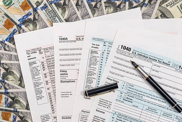 istock 1040 tax form on us money 596795612