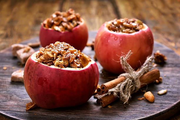 Baked apples stuffed with granola Fruit dessert baked apples stuffed with granola stuffing food photos stock pictures, royalty-free photos & images