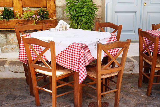 istock Traditional Greek Tavern Table Covered in Gingham Tablecloth 596796746