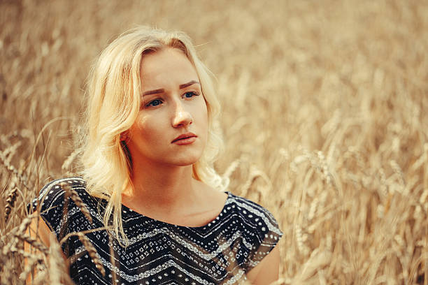 istock young beautiful girl in autumn field 596796832