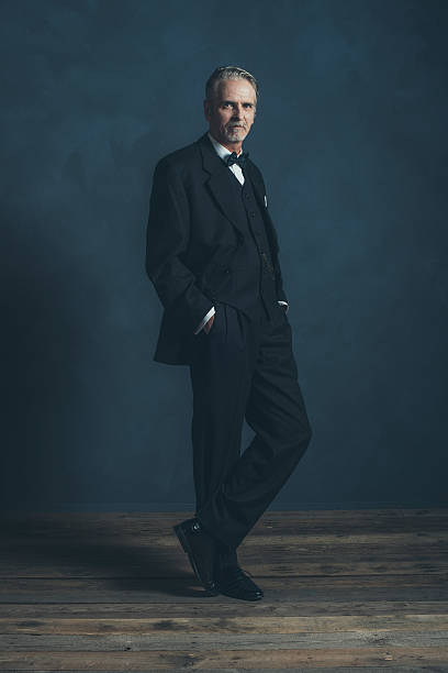 istock Confident middle aged retro 1920s businessman in black suit. 596798414