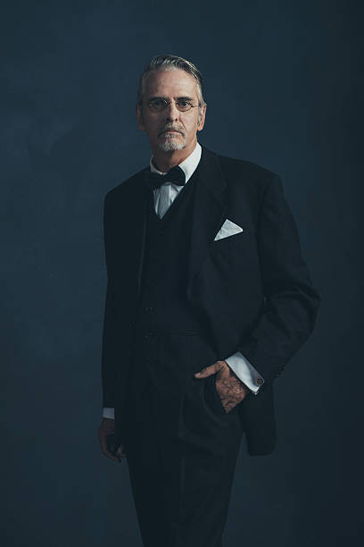 istock Middle aged retro 1920s businessman in black suit. 596798946