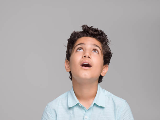 Portrait of young boy thinking