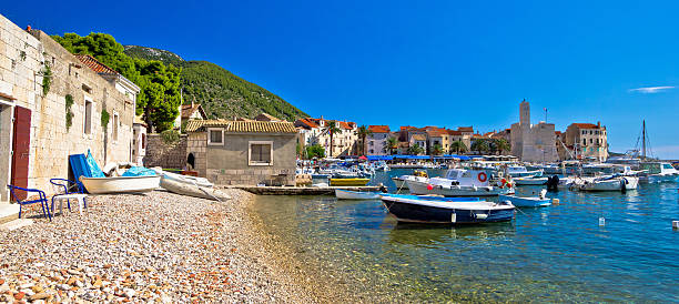 istock Komiza on Vis island beach and town 596800598