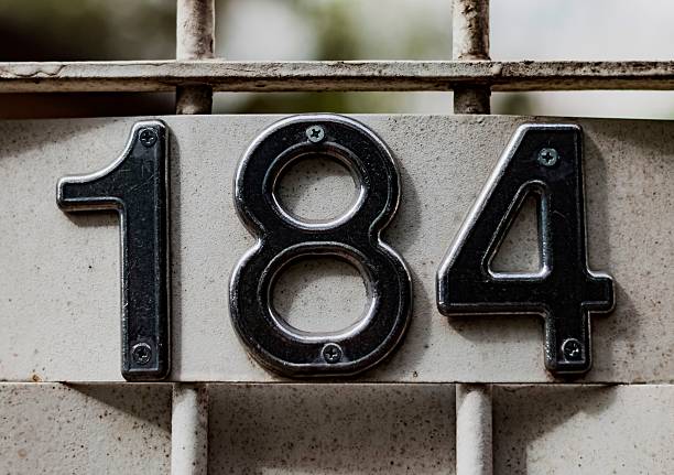 istock Numbers screwed to a gate of a residence 596801944