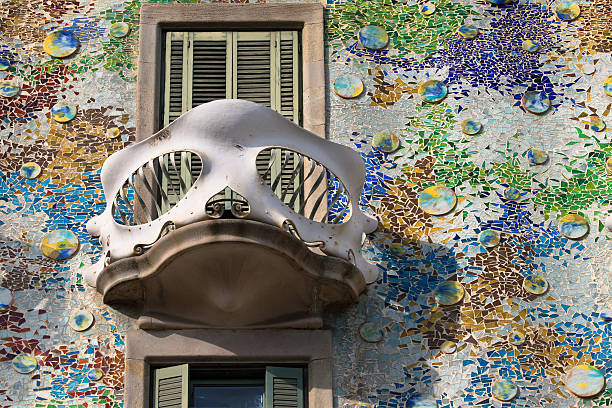 Balcony of the Casa Batllo Barcelona, Spain - August 17, 2016: Balcony in the shape of mask from the Casa Batllo, designed by Antoni Gaudi during 1904-1906, in Barcelona, Spain. casa stock pictures, royalty-free photos & images