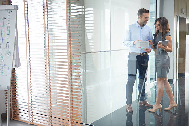 istock Business partners behind glass wall 596804160