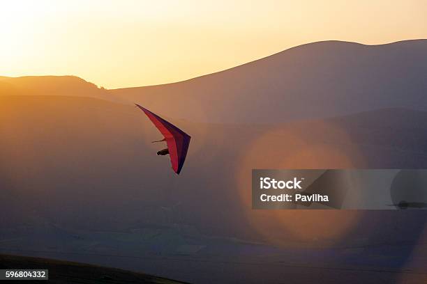 Ultralight Hang Glider Pilot Launchinglens Flarecastelluccioapenninesitaly Stock Photo - Download Image Now
