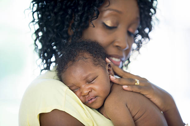 istock Holding Her Newborn baby 596804956