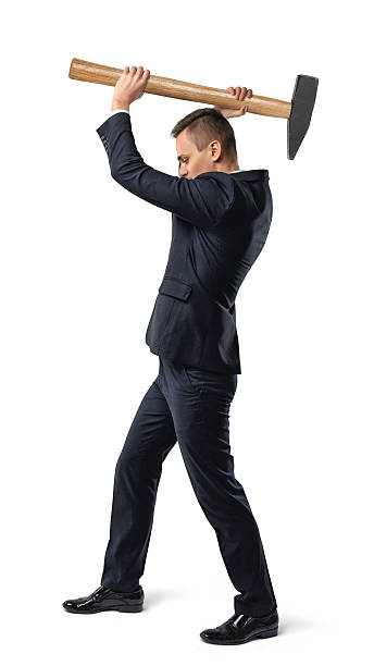 istock Businessman raising a big mallet 596806156
