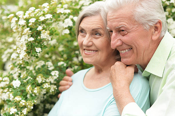 istock Mature couple in spring park 596806632