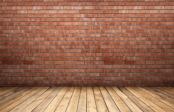 istock Red brick wall and wooden floor 596806910