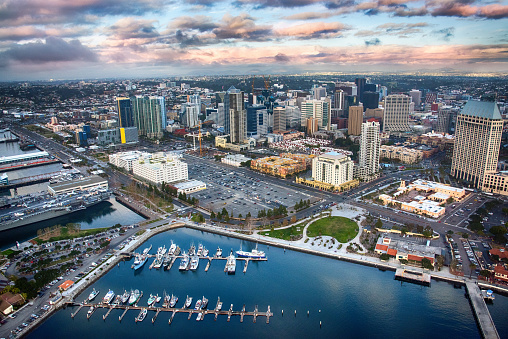 Beautiful downtown San Diego California shot from an orbiting helicopter near sunset after a storm.
