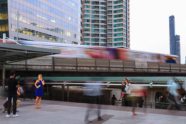 Bangkok, Thailand - December 21, 2015: Bangkok's city life with BTS sky train at Chong Nonsi elevated walkway in the evening.