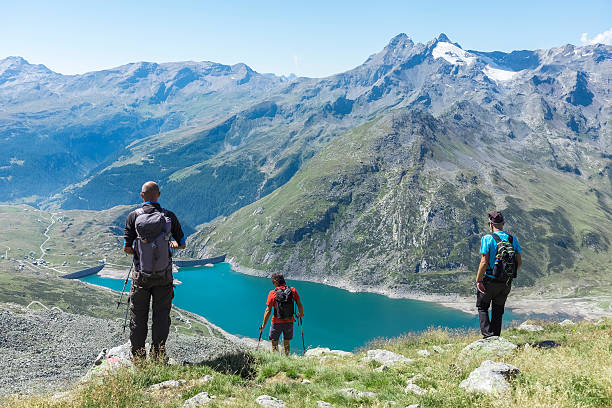 istock Hiker on top of the mountain range 596809338