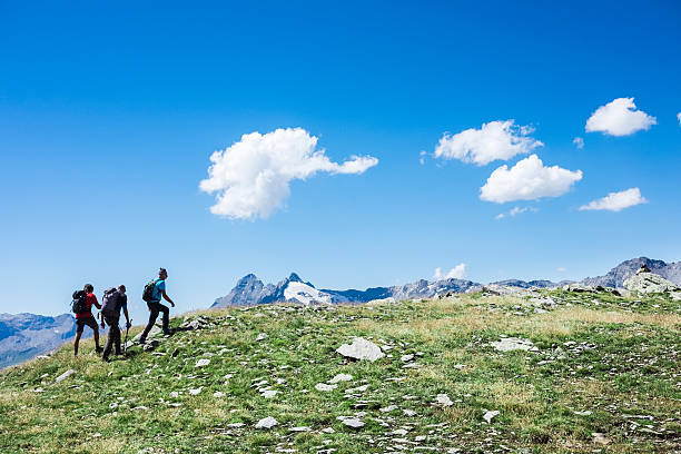 istock Hiker on top of the mountain range 596809402