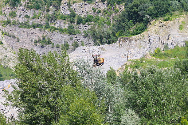 istock Extraction of mineral resources in the granite quarry 596810884