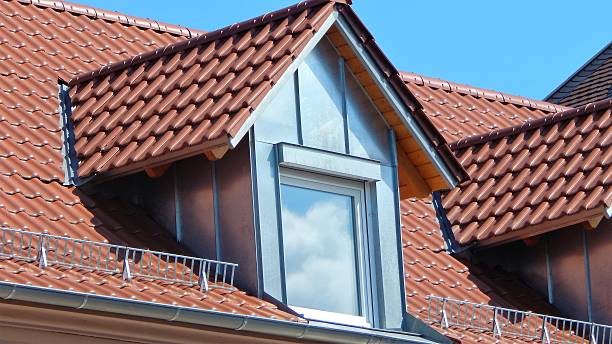 istock Red tile roof with dormers 596812472