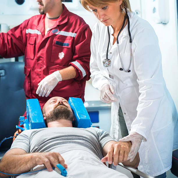 istock Medics caring for patient in ambulance 596813574