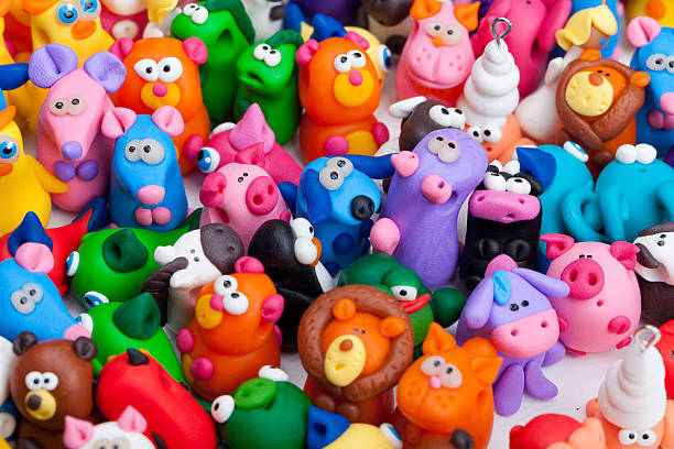 Large group of clay toys Large group of clay toys. Horizontal shot, high angle, close up polymer clay stock pictures, royalty-free photos & images
