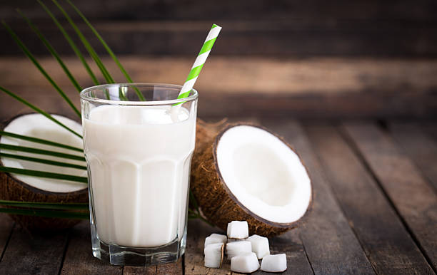Coconut milk in the glass Coconut milk in the glass  coconut milk photos stock pictures, royalty-free photos & images