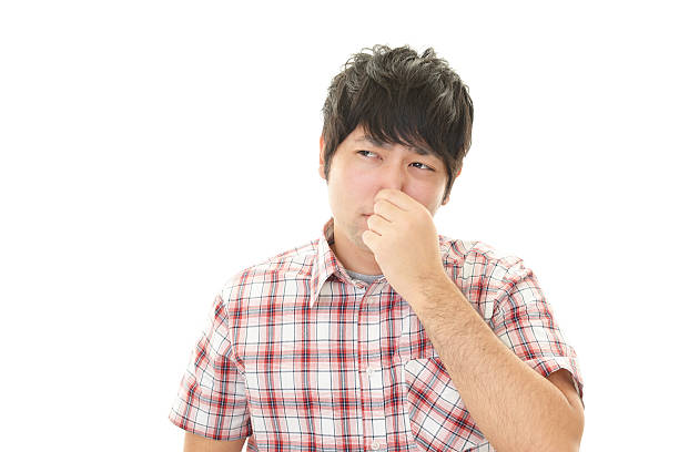 istock Man pinches his nose 596815934