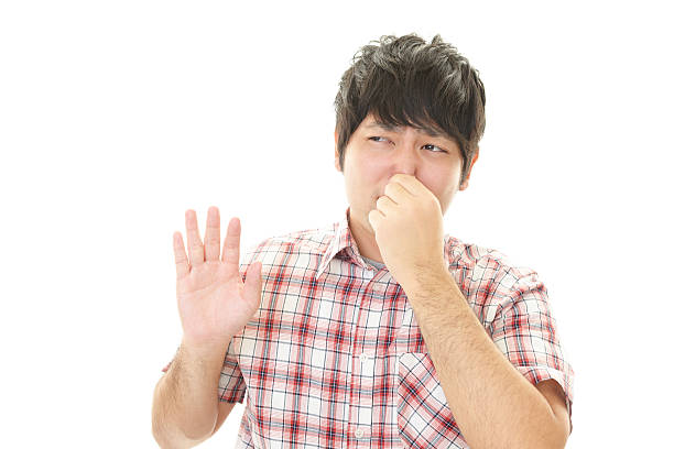 istock Man pinches his nose 596816142