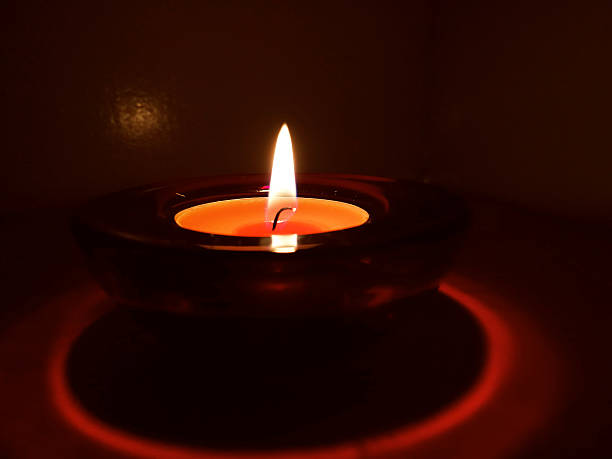 Candles in red and yellow transparent chandeliers