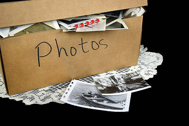 old family photos on cardboard box stock photo