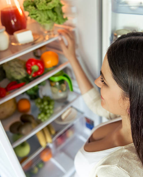 istock Pregnant woman in the kitchen 597216760
