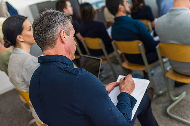 istock Close up of audience at seminar 597216922