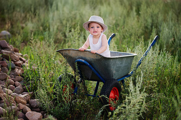 istock little boy with wheelbarrow 597218796