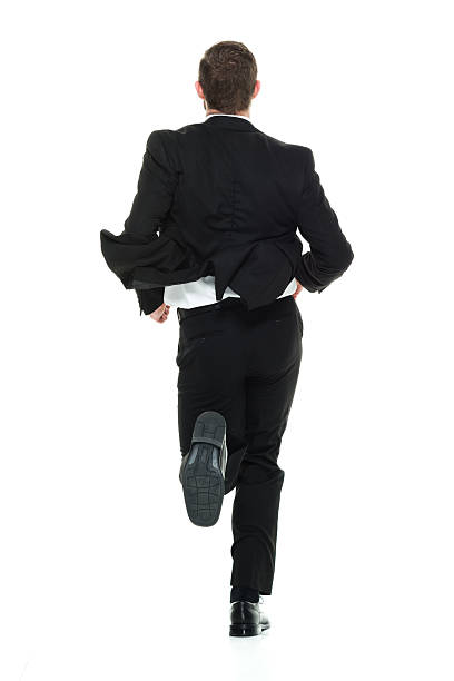 Rear view of businessman runninghttp://www.twodozendesign.info/i/1.png