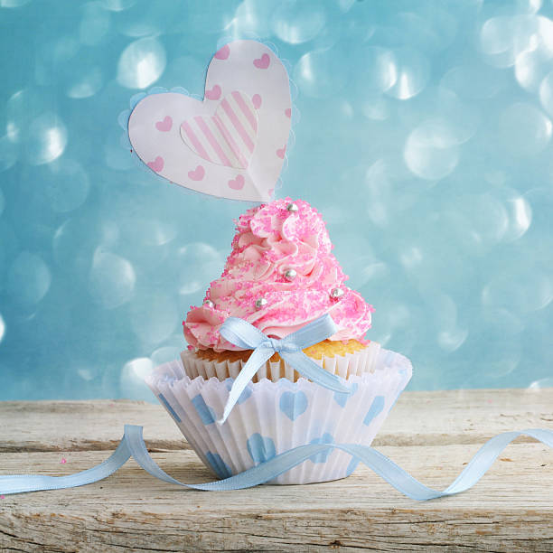 istock Love cupcake with hearts and butter cream 597221234