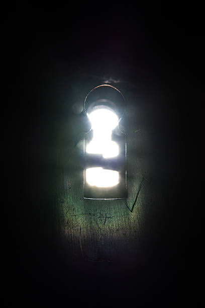 istock Bright Light Rays Shining Keyhole Door Lock Opportunity 597221652