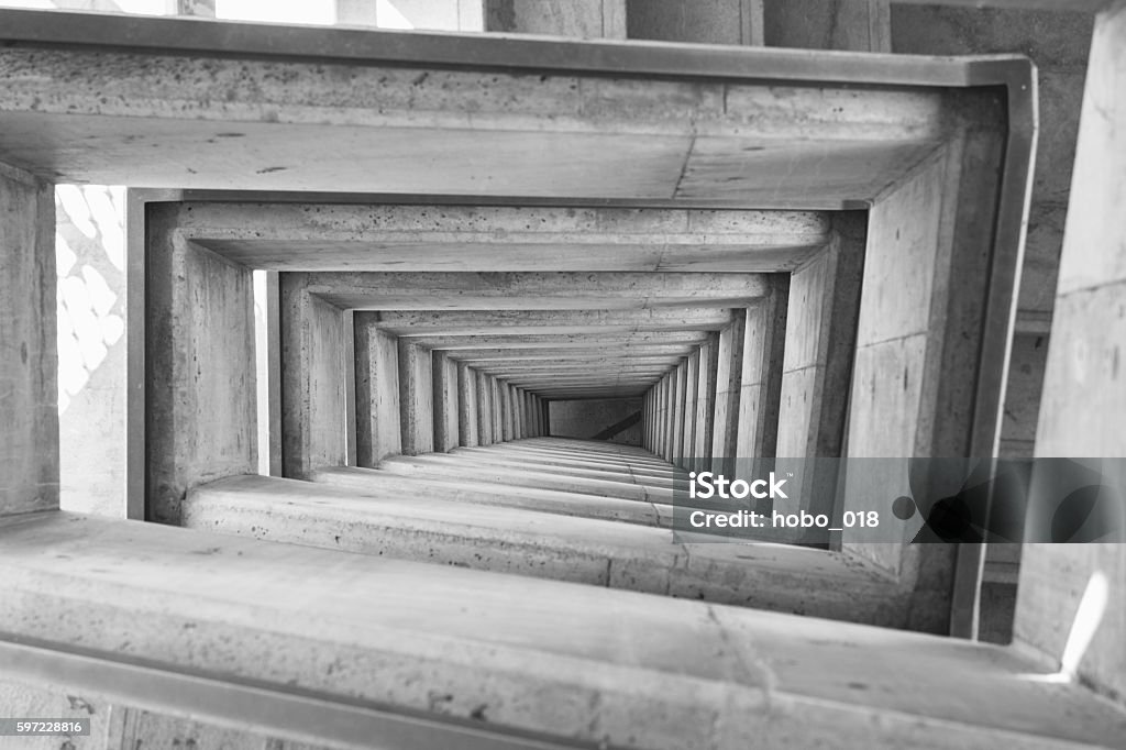 Spiral square stairs viewed from above Spiral square stairs of a tall building viewed from above Contrasts Stock Photo