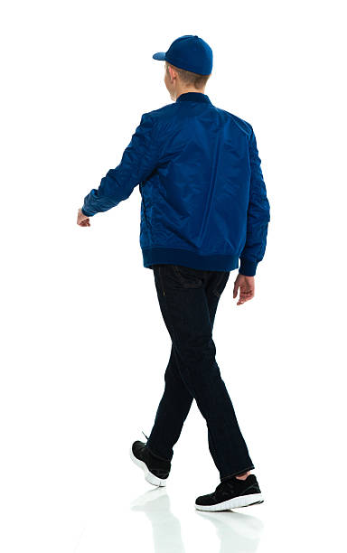 istock Rear view of male walking 597229626