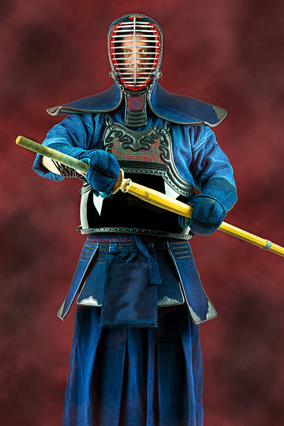 istock Kendo - Kendoka in full armor and bamboo sword. 597231412