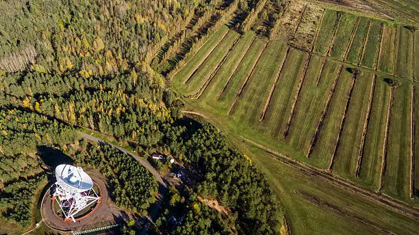 Aerial view radio telescope in forest at countryside in saint-Petersburg Russia