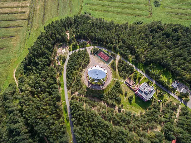 Aerial view radio telescope in forest at countryside in saint-Petersburg Russia