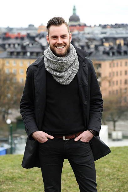 istock Man looking around with cityscape 597237086