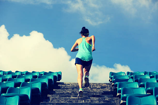 istock Runner athlete running on stairs. 597238040