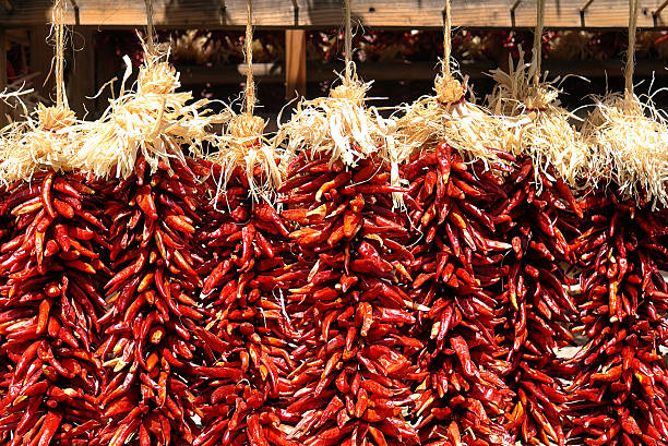 istock Santa Fe Hot Red Chili Peppers Ristras Hanging 597238462