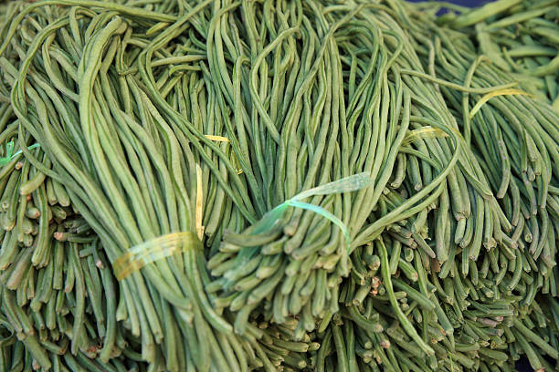 istock fresh green bean selling on vegetable market 597241492