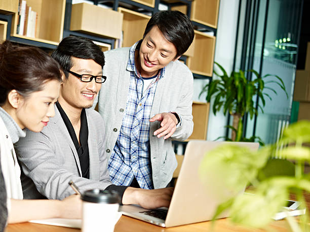 istock asian business team working together in office 597241968
